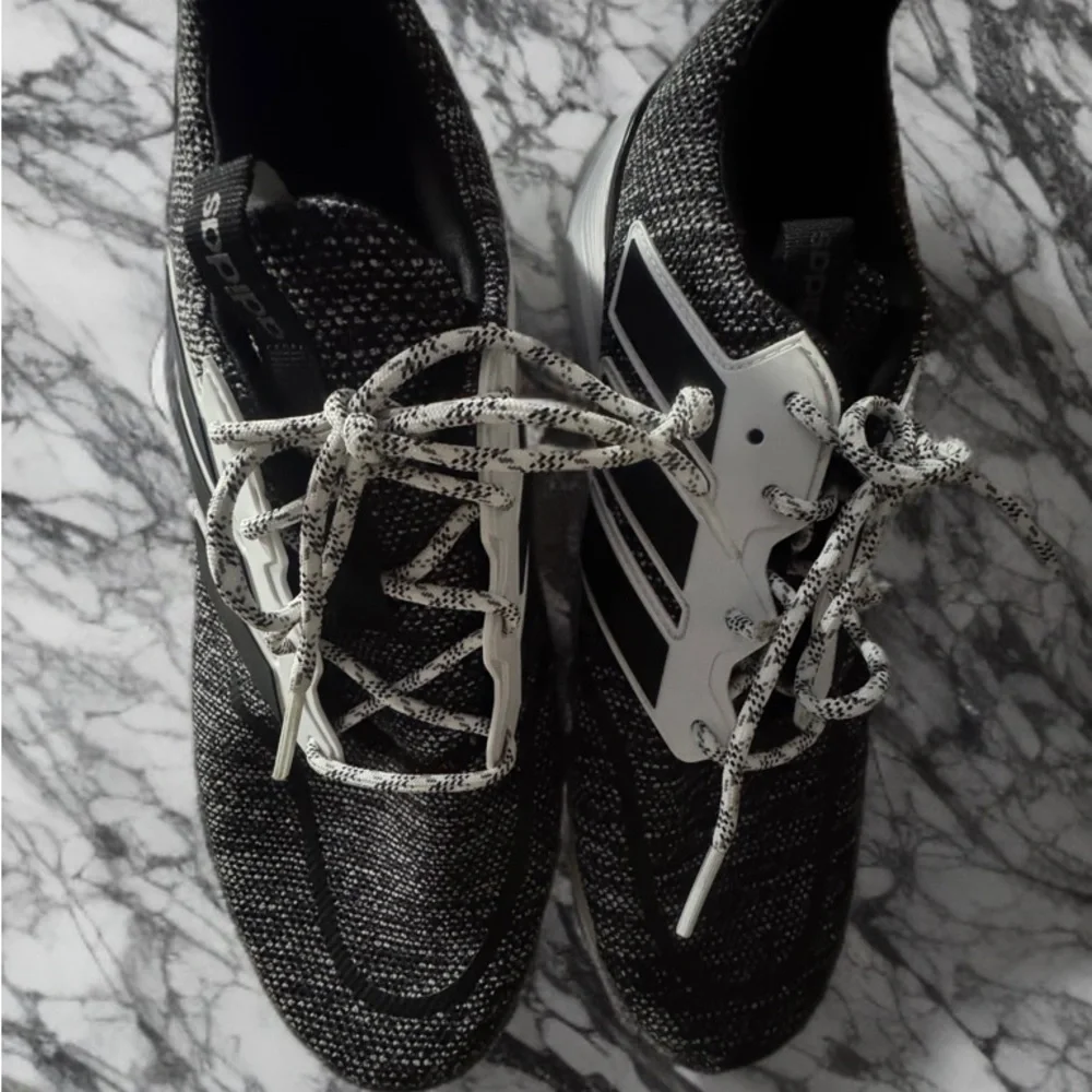Adidas Black and White Sneakers with Sleek Design